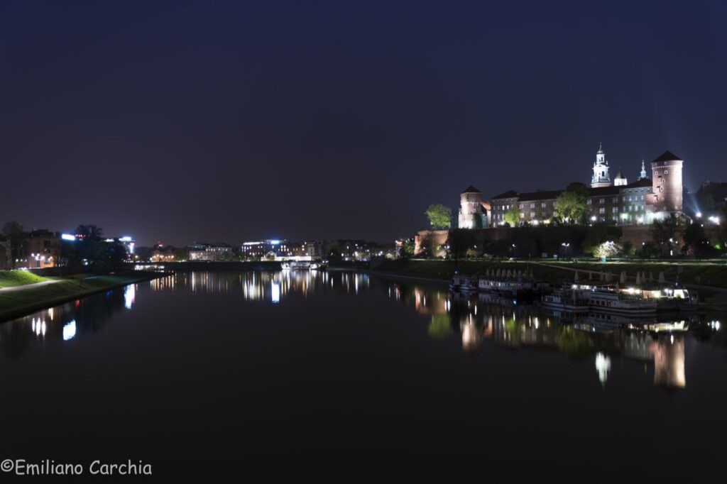 Wawel Royal Castle at night above the Vistula